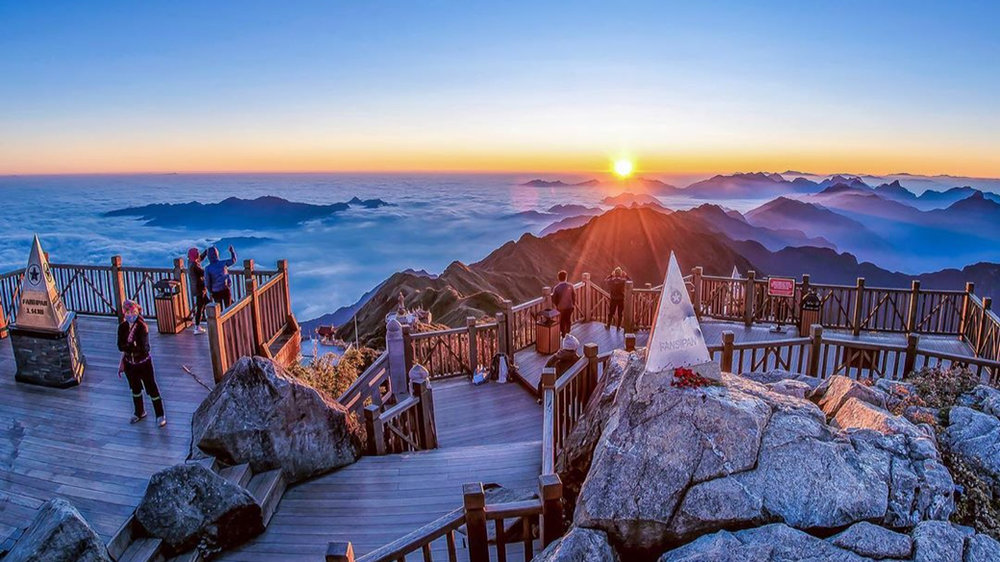 Fansipan on a clear day, with wide mountain views stretching across northern Vietnam.