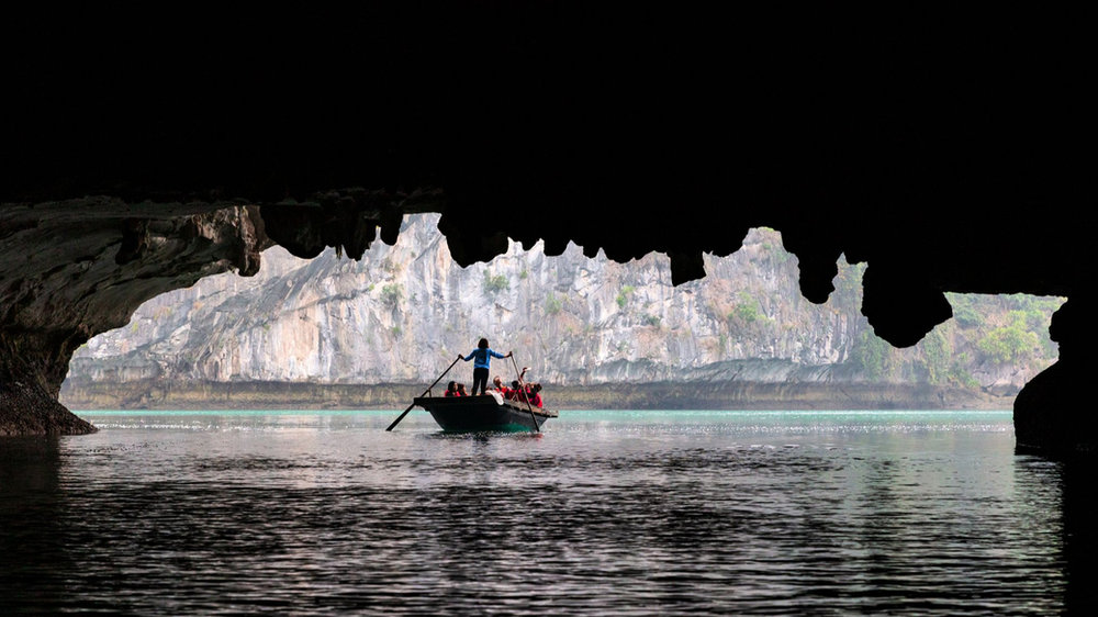 Dark and Bright Cave, explored by kayak or bamboo boat in Lan Ha Bay.