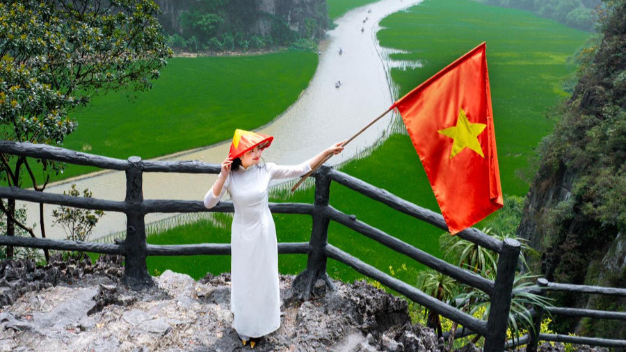Tam Coc in April, when the rice fields turn fresh green across the valley