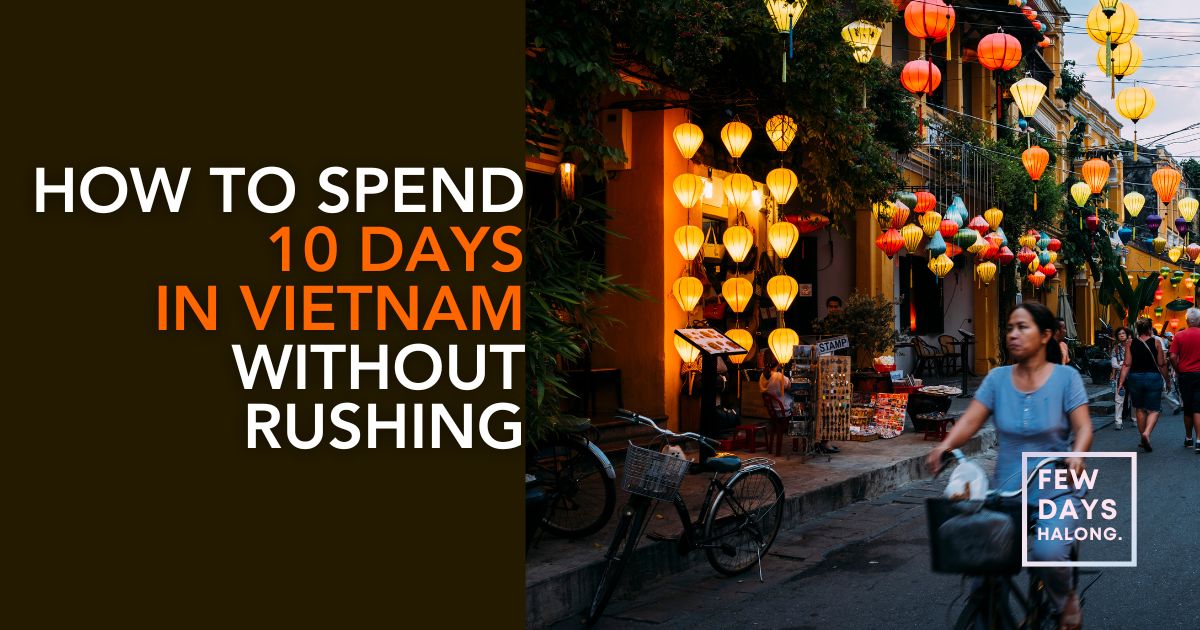 Lantern-lit street in Hoi An old town at dusk with a woman cycling past