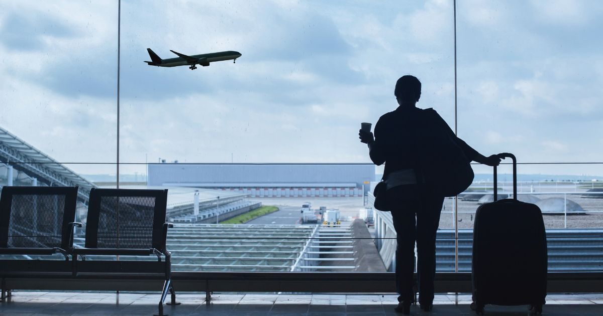 Traveller at the airport watching a departure - no health form needed for Vietnam just yet