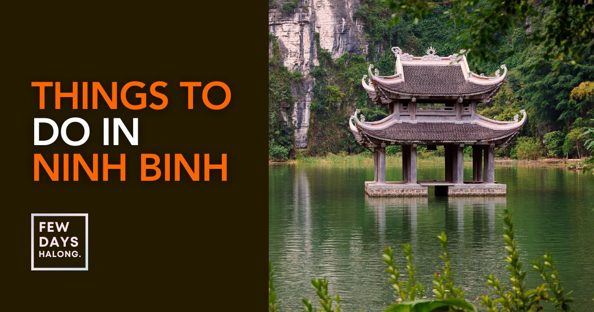 Karst peaks rising over the river and rice fields at Tam Coc in Ninh Binh