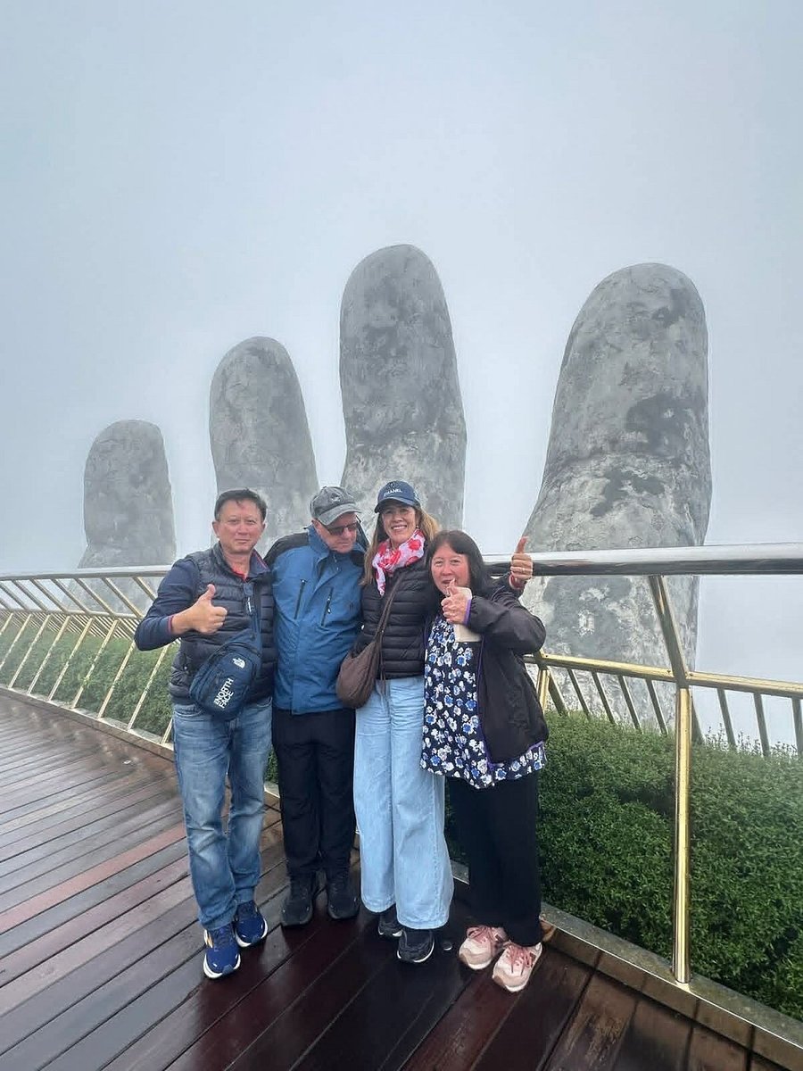 Apple and family at the Golden Bridge in the Ba Na Hills Apple and family at the Golden Bridge in the Ba Na Hills