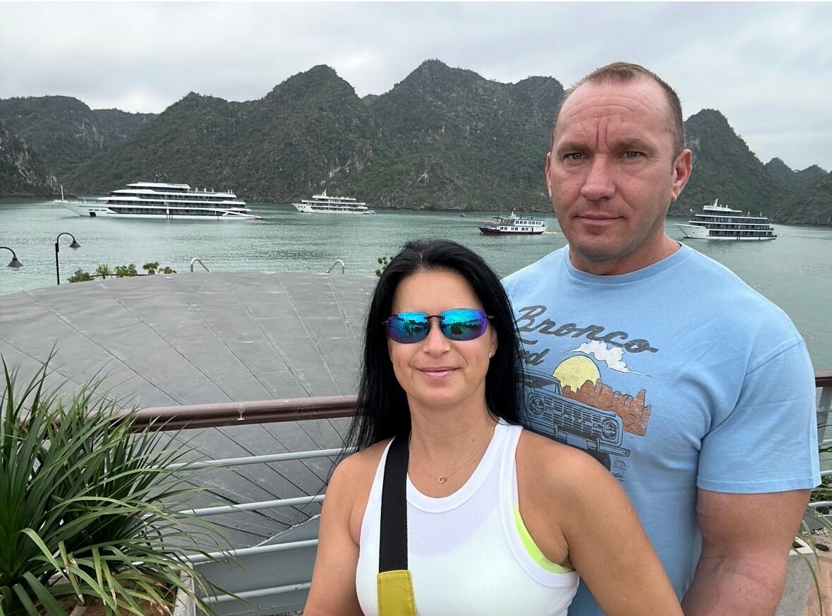 Csilla and Fabian at a Lan Ha Bay viewpoint with the cruise ships behind Csilla and Fabian at a Lan Ha Bay viewpoint with the cruise ships behind